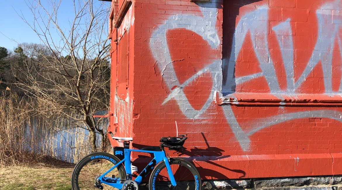 QR bike leaning against a shed