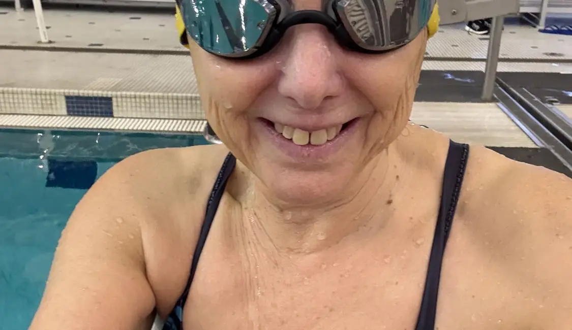 Hilary wearing snake and pig